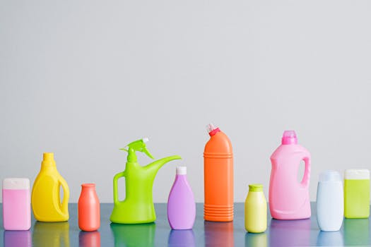 A vibrant assortment of cleaning product containers arranged on a reflective surface, perfect for household sanitation themes.